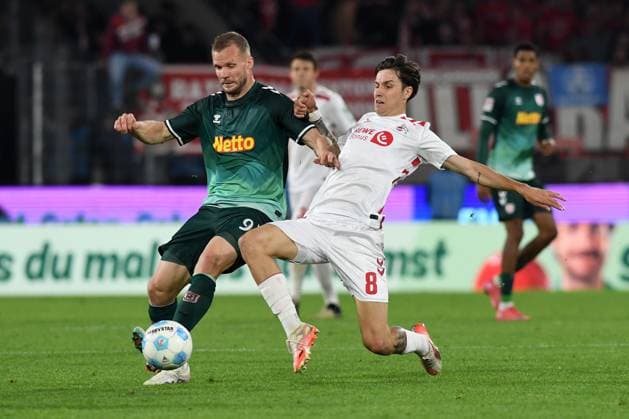Eric Hottmann Jahn Regensburg and Denis Huseinbasic 1 FC Koeln battle for the ball during the 2 Bundesliga match between 1 FC Köln and Jahn Regensburg at RheinEnergieStadion on May 03, 2025 in Cologne, Germany, Germany Photo by Ralf Treese DeFodi Images Eric Hottmann Jahn Regensburg and Denis Huseinbasic 1 FC Koeln battle for the ball during the 2 Bundesliga match between 1 FC Köln and Jahn Regensburg at RheinEnergieStadion on May 3, 2025 in Cologne, Germany Photo by Ralf Treese DeFodi Images DFB DFL REGULATIONS PROHIBIT ANY USE OF PHOTOGRAPHS AS IMAGE SEQUENCES AND OR QUASI VIDEO Photo by Ralf Treese DeFodi Images