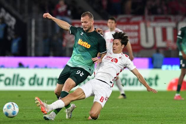 Eric Hottmann Jahn Regensburg and Denis Huseinbasic 1 FC Koeln battle for the ball during the 2 Bundesliga match between 1 FC Köln and Jahn Regensburg at RheinEnergieStadion on May 03, 2025 in Cologne, Germany, Germany Photo by Ralf Treese DeFodi Images Eric Hottmann Jahn Regensburg and Denis Huseinbasic 1 FC Koeln battle for the ball during the 2 Bundesliga match between 1 FC Köln and Jahn Regensburg at RheinEnergieStadion on May 3, 2025 in Cologne, Germany Photo by Ralf Treese DeFodi Images DFB DFL REGULATIONS PROHIBIT ANY USE OF PHOTOGRAPHS AS IMAGE SEQUENCES AND OR QUASI VIDEO Photo by Ralf Treese DeFodi Images