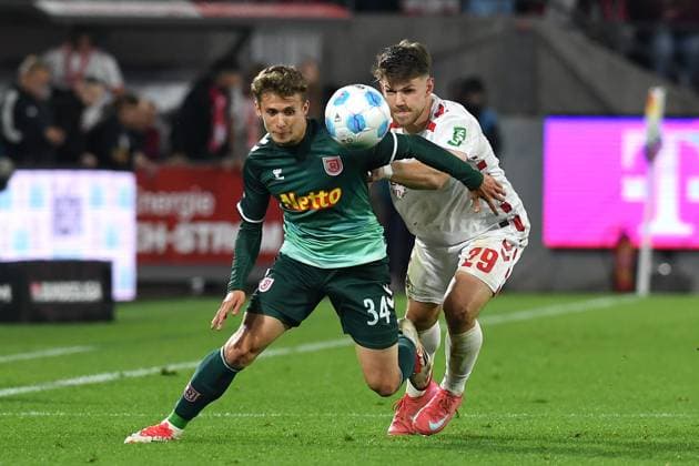 Anssi Suhonen Jahn Regensburg and Jan Thielmann 1 FC Koeln battle for the ball during the 2 Bundesliga match between 1 FC Köln and Jahn Regensburg at RheinEnergieStadion on May 03, 2025 in Cologne, Germany, Germany Photo by Ralf Treese DeFodi Images Anssi Suhonen Jahn Regensburg and Jan Thielmann 1 FC Koeln battle for the ball during the 2 Bundesliga match between 1 FC Köln and Jahn Regensburg at RheinEnergieStadion on May 3, 2025 in Cologne, Germany Photo by Ralf Treese DeFodi Images DFB DFL REGULATIONS PROHIBIT ANY USE OF PHOTOGRAPHS AS IMAGE SEQUENCES AND OR QUASI VIDEO Photo by Ralf Treese DeFodi Images