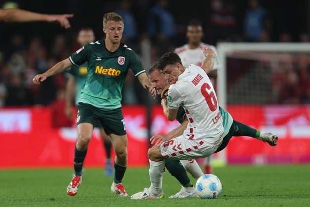Eric Martel 1 FC Koeln and Eric Hottmann SSV Jahn Regensburg battle for the ball during the 2 Bundesliga match between 1 FC Koeln and Jahn Regensburg at RheinEnergieStadion on May 03, 2025 in Cologne, Germany, Germany Photo by Oliver Kaelke DeFodi Images Eric Martel 1 FC Koeln and Eric Hottmann SSV Jahn Regensburg battle for the ball during the 2 Bundesliga match between 1 FC Köln and Jahn Regensburg at RheinEnergieStadion on May 3, 2025 in Cologne, Germany Photo by Oliver Kaelke DeFodi Images DFB DFL REGULATIONS PROHIBIT ANY USE OF PHOTOGRAPHS AS IMAGE SEQUENCES AND OR QUASI VIDEO Photo by Oliver Kaelke DeFodi Images
