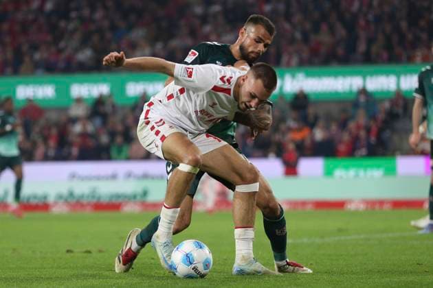 Tim Lemperle 1 FC Koeln and Robin Ziegele SSV Jahn Regensburg battle for the ball during the 2 Bundesliga match between 1 FC Koeln and Jahn Regensburg at RheinEnergieStadion on May 03, 2025 in Cologne, Germany, Germany Photo by Oliver Kaelke DeFodi Images Tim Lemperle 1 FC Koeln and Robin Ziegele SSV Jahn Regensburg battle for the ball during the 2 Bundesliga match between 1 FC Köln and Jahn Regensburg at RheinEnergieStadion on May 3, 2025 in Cologne, Germany Photo by Oliver Kaelke DeFodi Images DFB DFL REGULATIONS PROHIBIT ANY USE OF PHOTOGRAPHS AS IMAGE SEQUENCES AND OR QUASI VIDEO Photo by Oliver Kaelke DeFodi Images