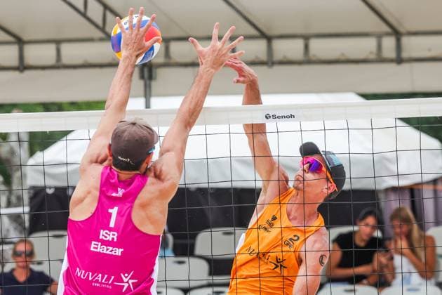 (250504) -- LAGUNA PROVINCE, May 4, 2025 -- Dimitrios Chatzinikolaou (R) of Greece competes against Eylon Elazar of Israel during the men s semifinal match between Dimitrios Chatzinikolaou Stavros Ntallas of Greece and Kevin Cuzmiciov Eylon Elazar of Israel at the Volleyball World Beach Pro Tour Futures in Laguna Province, the Philippines, May 4, 2025. ) (SP)PHILIPPINES-LAGUNA PROVINCE-VOLLEYBALL WORLD BEACH PRO TOUR FUTURES ROUELLExUMALI 