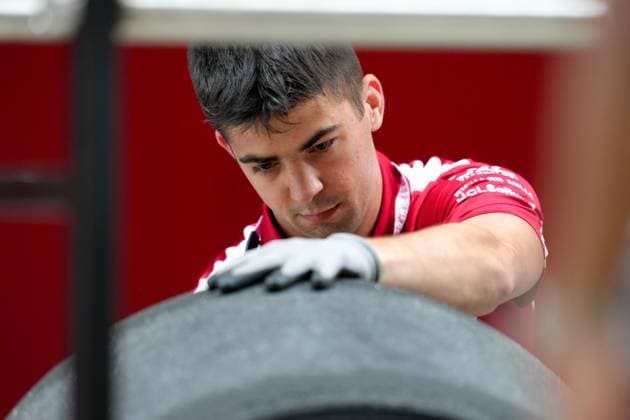 A crew member with Team Ferrari works with tires  Copyright: xScottxColeman IPAxSportx xipa-agency.netx xx IPA_57251420 IPA_Agency_IPA57251420