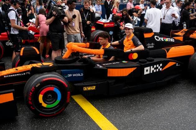 British Formula One driver Lando Norris and Australian Formula One driver Oscar Piastri of McLaren F1 Team are seen in a Lego car before the drivers parade during the Formula One Miami Grand Prix at the Miami International Autodrome in Miami Gardens, Florida on Sunday, May 4, 2025.  MIA2025050437 GREGxNASH