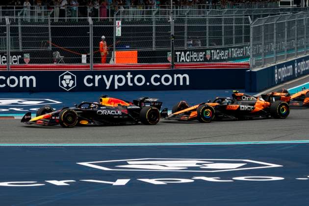 Dutch Formula One driver Max Verstappen of Red Bull Racing leads from British Formula One driver Lando Norris of McLaren F1 Team into turn one during the Formula One Miami Grand Prix at the Miami International Autodrome in Miami Gardens, Florida on Sunday, May 4, 2025.  MIA2025050443 GREGxNASH