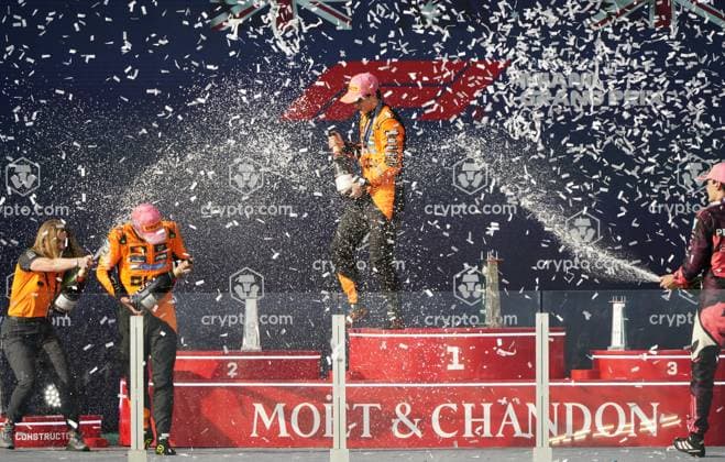 (250505) -- MIAMI, May 5, 2025 -- First placed McLaren s driver Oscar Piastri (2nd R) of Australia, second placed McLaren s Lando Norris (2nd L) of Britain, third placed Mercedes George Russell (1st R) of Britain and McLaren Chief Marketing Officer Louise McEwen spray the champagne on the podium after the race of the Formula One Miami Grand Prix at Miami International Autodrome in Miami, the United States, May 4, 2025. ) (SP)U.S.-MIAMI-FORMULA 1 WuxXiaoling 