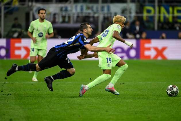 Henrix Mkhitaryan of FC Internazionale and Lamine Yamal of Barcelona during the UEFA Champions League 2024 2025 semifinal between FC Internazionale and FC Barcelona, Barca at San Siro stadium in Milano (Italy), May 6, 2025. AndreaxStaccioli