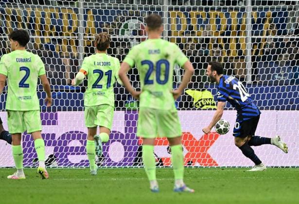 (250507) -- MILAN, May 7, 2025 -- Inter Milan s Hakan Calhanoglu (1st R) scores his team s second goal from the penalty spot during the UEFA Champions League semifinal second leg match between Inter Milan and Barcelona in Milan, Italy, May 6, 2025. (Photo by Xinhua) (SP)ITALY-MILAN-FOOTBALL-UEFA CHAMPIONS LEAGUE-INTER MILAN VS BARCELONA AlbertoxLingria 