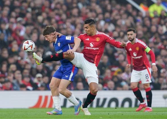 Manchester, England, 8th May 2025. Mikel Jauregizar of Athletic Bilbao and Casemiro of Manchester United, ManU battle for the ball during the Manchester United vs Athletic Bilbao UEFA Europa League Semi Final, 2nd Leg match at Old Trafford, Manchester. Picture credit should read: Andrew Yates Sportimage EDITORIAL USE ONLY. No use with unauthorised audio, video, data, fixture lists, club league logos or live services. Online in-match use limited to 120 images, no video emulation. No use in betting, games or single club league player publications. SPI_031_AY_MANCHESTER_UNITED_V_ATHLETIC_BILBAO SPI-3917-0031