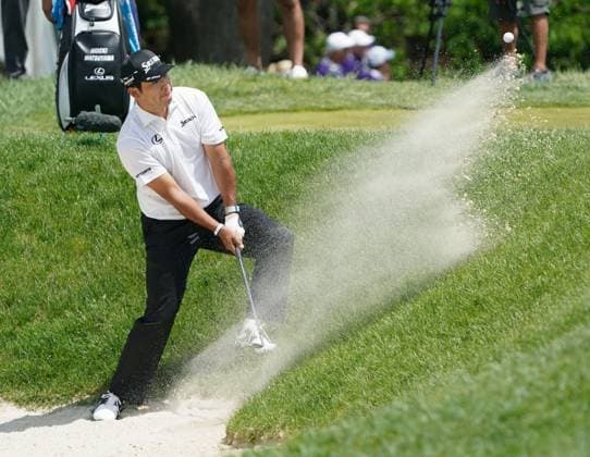 Golf: Truist Championship Hideki Matsuyama of Japan hits out of a bunker during the first round of the Truist Championship golf tournament at Philadelphia Cricket Club in Flourtown, Pennsylvania, on May 8, 2025.  A14AA0004528843P