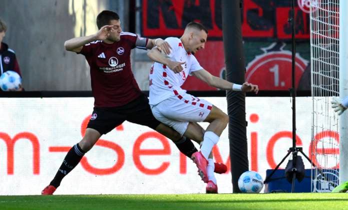 09 05 2025 Soccer Season 2024 2025 2 Soccer Bundesliga 33 Matchday 1 FC Nürnberg FCN Club 1 FC Köln Sportfoto Zink xwoxzix DFL regulations prohibit any use of photographs as image sequences and or quasi video only for editorial use Tim Drexler 5, 1 FC Nürnberg FCN Tim Lemperle 19, FC Köln Foul or not Videobeweis VAR