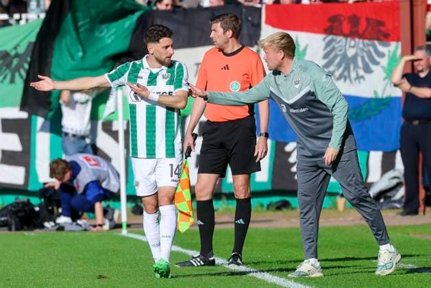 Charalambos Makridis SC Preussen Muenster and interim coach Kieran Schulze Marmeling SC Preussen Muenster talk together, 2 Bundesliga, Preußen Münster vs Hertha BSC, Preußenstadion on May 09, 2025 in Münster, Germany Photo by Marco Steinbrenner DeFodi Images Charalambos Makridis SC Preussen Muenster and interim coach Kieran Schulze Marmeling SC Preussen Muenster talk together, 2 Bundesliga, Preußen Münster vs Hertha BSC, Preußenstadion, May 9, 2025 in Münster, Germany Photo by Marco Steinbrenner DeFodi Images DFB DFL REGULATIONS PROHIBIT ANY USE OF PHOTOGRAPHS AS IMAGE SEQUENCES AND OR QUASI VIDEO