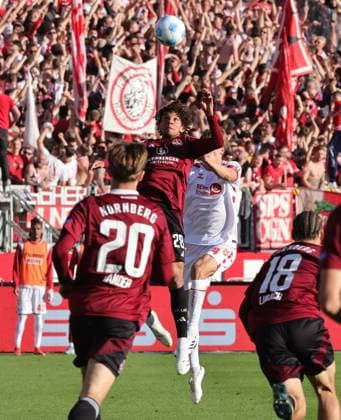 09 05 2025 Soccer Season 2024 2025 2 Soccer Bundesliga 33 Matchday 1 FC Nürnberg FCN Club 1 FC Köln Sportfoto Zink DaMa xdaxmax DFL regulations prohibit any use of photographs as image sequences and or quasi video only for editorial use Janis Antiste 28, 1 FC Nürnberg FCN in header duel with header duel with Timo Hübers Huebers 4, FC Köln