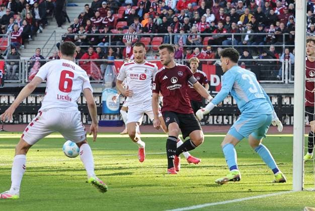 09 05 2025 Soccer season 2024 2025 2 Soccer Bundesliga 33 Matchday 1 FC Nuremberg FCN Club 1 FC Köln Sportfoto Zink DaMa xdaxmax DFL regulations prohibit any use of photographs as image sequences and or quasi video only for editorial use Robin Knoche 31, 1 FC Nuremberg FCN clears in front of Tim Lemperle 19, FC Köln