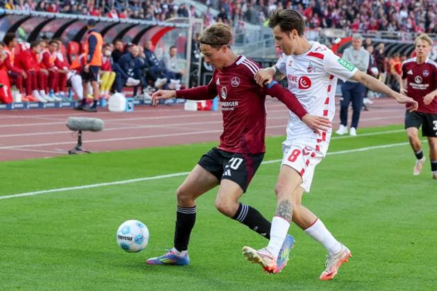 Caspar Jander 20 1FC Nuernberg and Denis Huseinbasic 8 1 FC Koeln in duel, 1 FC Nuernberg vs 1 FC Koeln Football, 2 Bundesliga, DFL, Saison 2024 2025, Rueckrunde, 33 Spieltag, 09 05 2025 DFB regulations prohibit any use of photographs as image sequences and or quasi video Copyright: xkolbert-press MartinxAgüerax