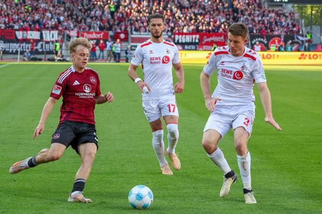 from left to right Tim Janisch 32 1FC Nuernberg , Leart Paqarada 17 1 FC Koeln and Eric Martel 6 1 FC Koeln in duel, 1 FC Nuernberg vs 1 FC Koeln Football, 2 Bundesliga, DFL, Saison 2024 2025, Rueckrunde, 33 Spieltag, 09 05 2025 DFB regulations prohibit any use of photographs as image sequences and or quasi video Copyright: xkolbert-press MartinxAgüerax