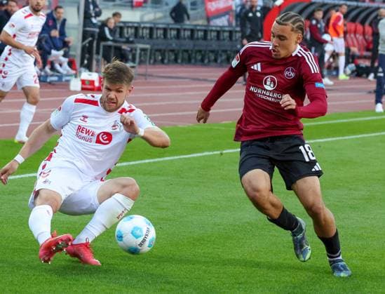 Jan Thielmann 29 1 FC Koeln and Rafael Lubach 18 1FC Nuernberg in duel, 1 FC Nuernberg vs 1 FC Koeln Football, 2 Bundesliga, DFL, Saison 2024 2025, Rueckrunde, 33 Spieltag, 09 05 2025 DFB regulations prohibit any use of photographs as image sequences and or quasi video Copyright: xkolbert-press MartinxAgüerax