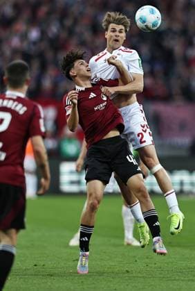 Tino Kusanovic, FCN, and Joel Pascal Schmied, FCK, in the second round match of the 2024 2025 season between 1 FC Nuremberg and 1 FC Cologne 1 2 in Nuremberg 09 05 2025