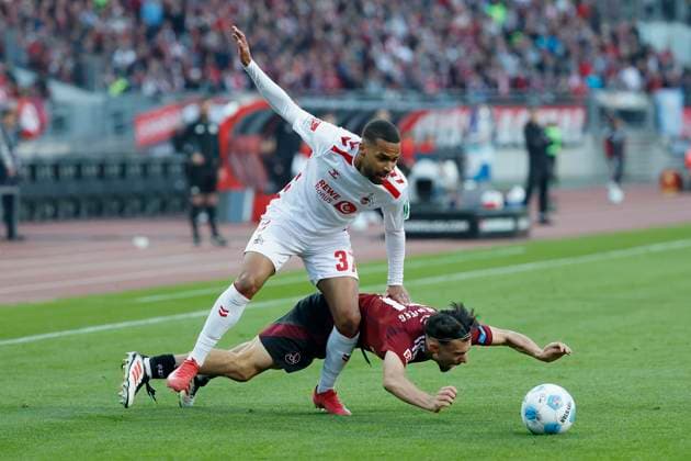 v l Linton Maina 1 FC Koeln, 37 and Berkay Yilmaz 1 FC Nuernberg, 21 , 09 05 2025, Football, 2 Bundesliga, 1 FC Nürnberg 1 FC Köln, GER, Nuernberg, Max Morlock Stadion, DFL REGULATIONS PROHIBIT ANY USE OF PHOTOGRAPHS AS IMAGE SEQUENCES AND OR QUASI VIDEO Copyright: HMBxMedia xHeikoxBecker