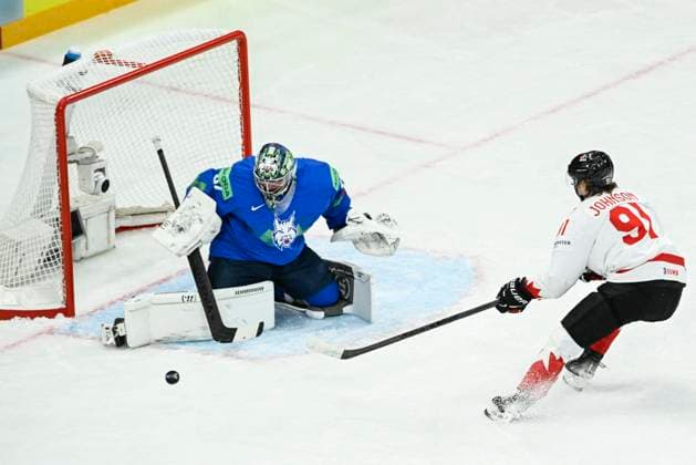 STOCKHOLM, SWEDEN 20250510 Slovenia s goalkeeper Lukas Horak and Canada s Kent Johnson in action during the IIHF Ice Hockey World Championship group A match between Slovenia and Canada at Avicii Arena in Stockholm, Sweden, on May 10, 2025 STOCKHOLM SWEDEN x10080x  Copyright: xFredrikxSandberg TTx ICE HOCKEY WC SLOVENIA-CANADA