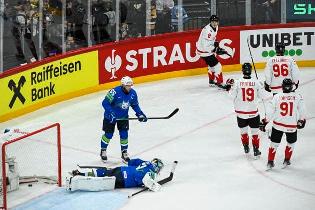 STOCKHOLM, SWEDEN 20250510 Canada s Noah Dobson 8, top celebrates after scoring at Slovenia s goalkeeper Lukas Horak left as Slovenia s Robert Sabolic 55 looks on during the IIHF Ice Hockey World Championship group A match between Slovenia and Canada at Avicii Arena in Stockholm, Sweden, on May 10, 2025 STOCKHOLM SWEDEN x10080x  Copyright: xFredrikxSandberg TTx ICE HOCKEY WC SLOVENIA-CANADA