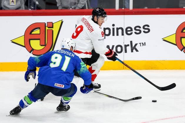 Ice hockey, Eishockey - IIHF WC 2025 STOCKHOLM,SWEDEN,10.MAY.25 - ICE HOCKEY - IIHF Ice Hockey World Championship, WM, Weltmeisterschaft 2025, group stage, Slovenia vs Canada. Image shows Zan Jezovsek (SLO) and Nate MacKinnon (CAN).  GEPAxpictures xMaticxKlansek