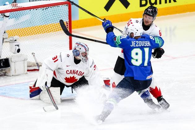 Ice hockey, Eishockey - IIHF WC 2025 STOCKHOLM,SWEDEN,10.MAY.25 - ICE HOCKEY - IIHF Ice Hockey World Championship, WM, Weltmeisterschaft 2025, group stage, Slovenia vs Canada. Image shows Dylan Garand (CAN), Zan Jezovsek (SLO) and Brandon Montour (CAN).  GEPAxpictures xMaticxKlansek