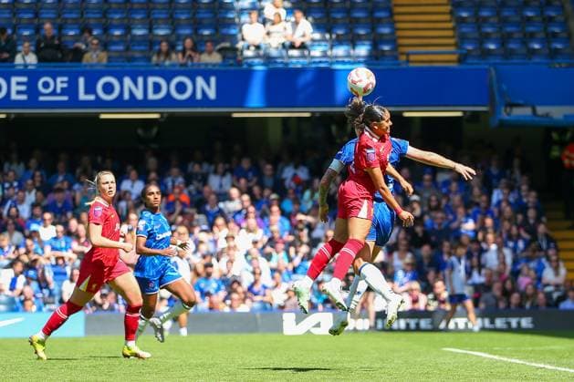 10th May 2025; Stamford Bridge, London, England; Womens Super League Football, Chelsea versus Liverpool; Olivia Smith of Liverpool jumps for a header before landing awkwardly on her ankle requiring treatment before being helped off and around the outside of the pitch and into the tunnel by two physios  ActionPlus12785118 KatiexChan