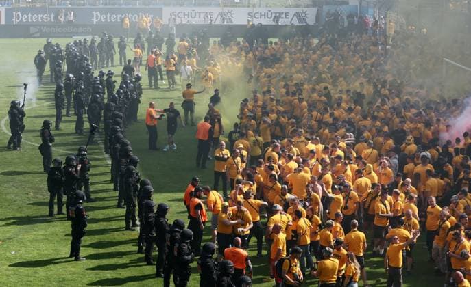 Mannheim, 10 05 2025, Carl Benz Stadion, Soccer, 3 Liga, 37 Matchday , SV Waldhof Mannheim vs SG Dynamo Dresden , Dresden cheers after the match Dynamo is promoted to the 2 Bundesliga , In the picture Dynamo fans celebrate police inside , For editorial use only Only editorial use , DFB DFL regulations prohibit any use of photographs as image sequences and or quasi video , Picture Point