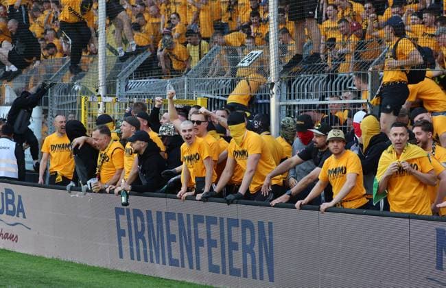 Mannheim, 10 05 2025, Carl Benz Stadion, Soccer, 3 Liga, 37 Matchday , SV Waldhof Mannheim vs SG Dynamo Dresden , Dresden cheers after the match Dynamo is promoted to the 2 Bundesliga , In the picture Dynamo fans celebrate police inside , For editorial use only Only editorial use , DFB DFL regulations prohibit any use of photographs as image sequences and or quasi video , Picture Point