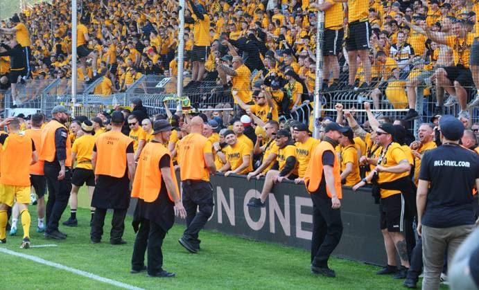 Mannheim, 10 05 2025, Carl Benz Stadion, Soccer, 3 Liga, 37 Matchday , SV Waldhof Mannheim vs SG Dynamo Dresden , Dresden cheers after the match Dynamo is promoted to the 2 Bundesliga , In the picture Dynamo fans celebrate police inside , For editorial use only Only editorial use , DFB DFL regulations prohibit any use of photographs as image sequences and or quasi video , Picture Point