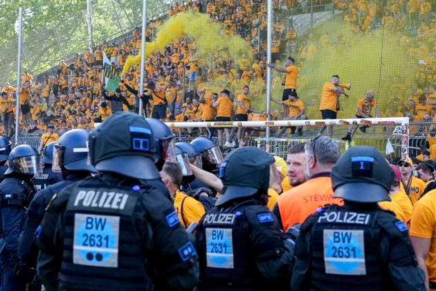 The Ultras of Dynamo Dresden cheer under observation of the police after the end of the game despite the defeat about the promotion, promoted, climber, cheering after the final whistle, joy, cheers, cheering, cheerful, positive, happy, happy, optimistic, highlight, action, fans, audience, spectators, mood, atmosphere, stadium, 10 05 2025, Mannheim Germany , soccer, 3 Liga, SV Waldhof Mannheim SG Dynamo Dresden, DFB DFL REGULATIONS PROHIBIT ANY USE OF PHOTOGRAPHS AS IMAGE SEQUENCES AND OR QUASI VIDEO xozx