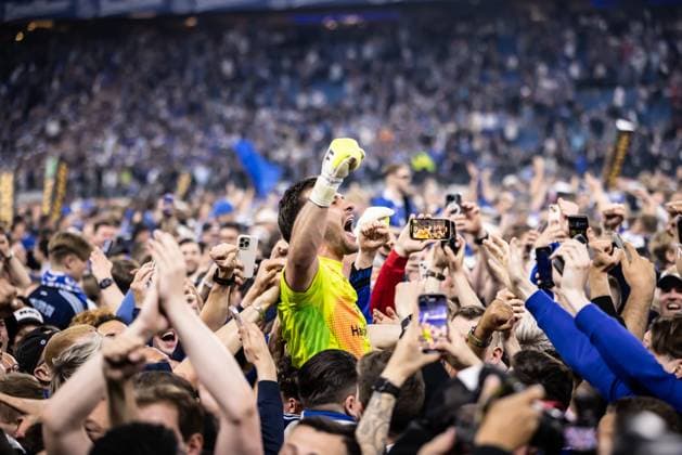 Soccer Men 2 Bundesliga 33 Matchday Season 2024 2025 Hamburger SV vs SSV Ulm 1846 Soccer 10 05 2025 10 05 2025, Soccer, Season 2024 2025, 2 Bundesliga, 33 Matchday, Hamburger SV SSV Ulm, Emotions Joy Cheers at Hamburger SVs promotion to 1 Bundesliga 1 Daniel Heuer Fernandes Hamburger SV in the crowd between the fans of Hamburger SV during the pitch storm Photo Lucca Fundel DFL regulations prohibit any use of photographs as image sequences and or quasi video Hamburg Volksparkstadion Hamburg Hamburg Germany