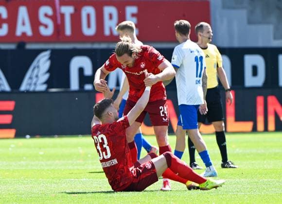 Football 2 Bundesliga Season 2024 25 1 FC Kaiserslautern 11 05 2025 Fritz Walter Stadion 1 FC Kaiserslautern fck SV Darmstadt 98 da 2 1 Jan ELVEDI 1 FC Kaiserslautern , left, and Jannis HEUER 1 FC Kaiserslautern after the end of the match 1 FC Kaiserslautern