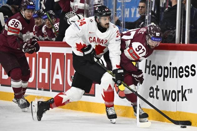 STOCKHOLM, SWEDEN 20250511 Canada s Phillip Danault and Latvia s Haralds Egle during the IIHF Ice Hockey World Championship group A match between Latvia and Canada at Avicii Arena in Stockholm, Sweden, on May 11, 2025 STOCKHOLM SWEDEN x10430x  Copyright: xChristinexOlsson TTx ICE HOCKEY WC LATVIA-CANADA