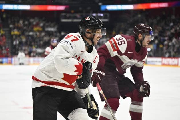 STOCKHOLM, SWEDEN 20250511 Canada s Sidney Crosby and Latvia s Oskars Batna during the IIHF Ice Hockey World Championship group A match between Latvia and Canada at Avicii Arena in Stockholm, Sweden, on May 11, 2025 STOCKHOLM SWEDEN x10430x  Copyright: xChristinexOlsson TTx ICE HOCKEY WC LATVIA-CANADA