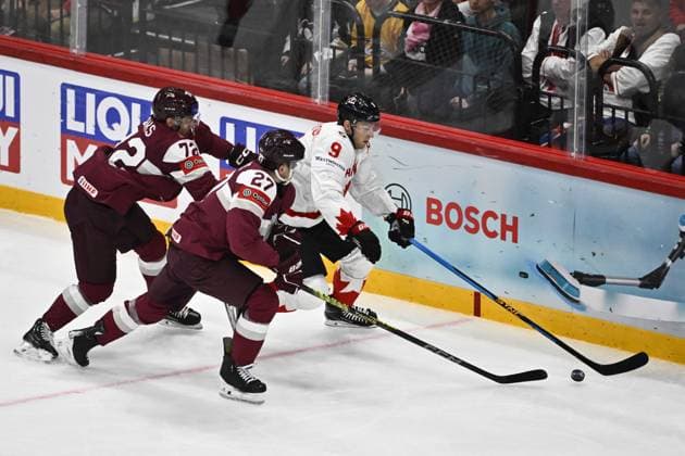 STOCKHOLM, SWEDEN 20250511 Canada s Nate MacKinnon and Latvia s Glebs Prohorenkovs during the IIHF Ice Hockey World Championship group A match between Latvia and Canada at Avicii Arena in Stockholm, Sweden, on May 11, 2025 STOCKHOLM SWEDEN x10430x  Copyright: xChristinexOlsson TTx ICE HOCKEY WC LATVIA-CANADA