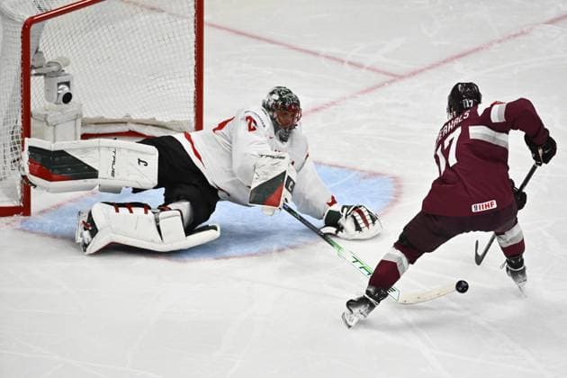 STOCKHOLM, SWEDEN 20250511 Latvia s Martins Dzierkals against Canada s goal keeper Marc Andre Fleury during the IIHF Ice Hockey World Championship group A match between Latvia and Canada at Avicii Arena in Stockholm, Sweden, on May 11, 2025 STOCKHOLM SWEDEN x10430x  Copyright: xChristinexOlsson TTx ICE HOCKEY WC LATVIA-CANADA
