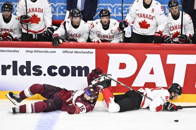 STOCKHOLM, SWEDEN 20250511 Latvia s Kaspars Daugavins and Canada s Ryker Evans during the IIHF Ice Hockey World Championship group A match between Latvia and Canada at Avicii Arena in Stockholm, Sweden, on May 11, 2025 STOCKHOLM SWEDEN x10430x  Copyright: xChristinexOlsson TTx ICE HOCKEY WC LATVIA-CANADA
