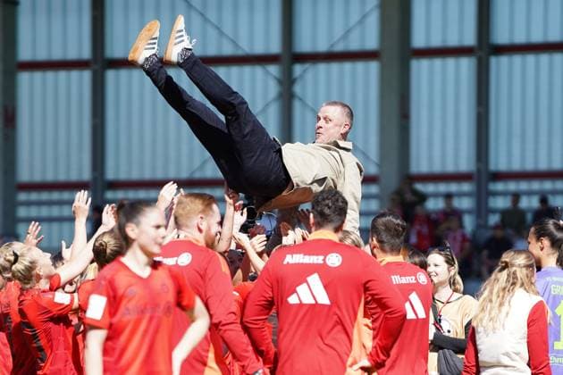FC Bayern players celebrate their coach Alexander Straus Coach Bayern after winning the German Google Pixel Womens Bundesliga 20024 2025 Championship on 11 05 2024 Munich FC Bayern Campus Bayern Germany