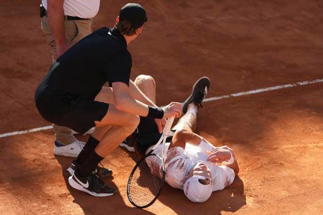 Jannik Sinner of Italy rescues Jesper de Jong of The Netherlands injured during their match at the Internazionali BNL d Italia 2025 tennis tournament at Foro Italico in Rome, Italy on May 12, 2025. Jannik Sinner won 6-4, 6-2. AntoniettaxBaldassarre