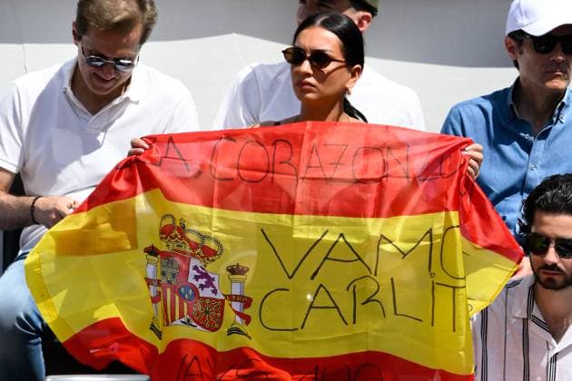 A fan of Carlos Alcaraz waves a flag during the match between Carlos Alcaraz of Spain and Karen Khachanov of Russia at the Internazionali BNL d Italia 2025 tennis tournament at Foro Italico in Rome, Italy on May 13, 2025. AndreaxStaccioli