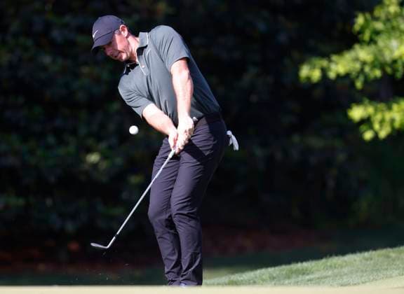 Rory McIlroy of Northern Ireland hits a pitch shot on the 12th hole in the first round of the 2025 PGA, Golf Herren Championship at the Quail Hollow Club in Charlotte, North Carolina on Thursday, May 15, 2025.  CHA2024051520171 TANNENxMAURY