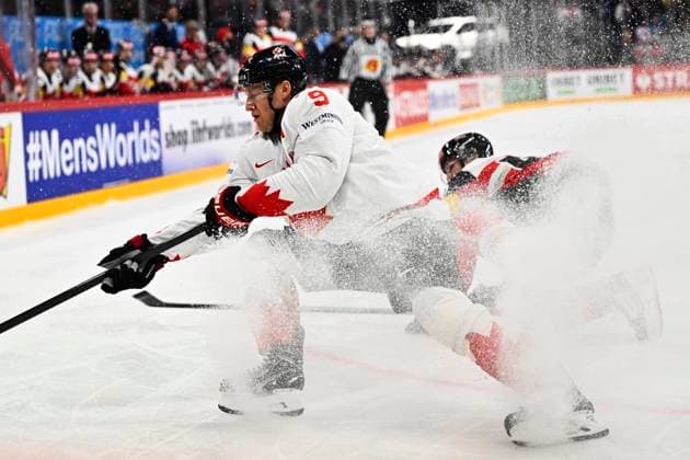 Canada s Nate MacKinnon and Austria s Gregor Biber during the IIHF Ice Hockey World Championship group A match between Canada and Austria at Avicii Arena in Stockholm, Sweden, on May 15, 2025 STOCKHOLM SWEDEN x10040x  Copyright: xAndersxWiklund TTx ICE HOCKEY WC CANADA-AUSTRIA