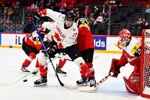 Canada s Will Cuylle and Austria s Dominique Heinrich and Florian Vorauer during the IIHF Ice Hockey World Championship group A match between Canada and Austria at Avicii Arena in Stockholm, Sweden, on May 15, 2025 STOCKHOLM SWEDEN x10040x  Copyright: xAndersxWiklund TTx ICE HOCKEY WC CANADA-AUSTRIA