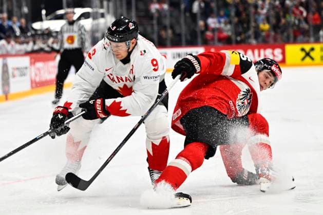 Canada s Nate MacKinnon and Austria s Gregor Biber during the IIHF Ice Hockey World Championship group A match between Canada and Austria at Avicii Arena in Stockholm, Sweden, on May 15, 2025 STOCKHOLM SWEDEN x10040x  Copyright: xAndersxWiklund TTx ICE HOCKEY WC CANADA-AUSTRIA