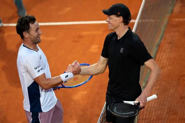 Casper Ruud of Norway and Jannik Sinner of Italy greet each other at the end of their match at the Internazionali BNL d Italia 2025 tennis tournament at Foro Italico in Rome, Italy on May 15, 2025. Jannik Sinner won 6-0, 6-1. AntoniettaxBaldassarre