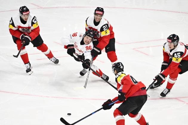 STOCKHOLM, SWEDEN 20250515 Canada s Macklin Celebrini and Austria s Lukas Haudum during the IIHF Ice Hockey World Championship group A match between Canada and Austria at Avicii Arena in Stockholm, Sweden, on May 15, 2025 STOCKHOLM SWEDEN x10040x  Copyright: xAndersxWiklund TTx ICE HOCKEY WC CANADA-AUSTRIA