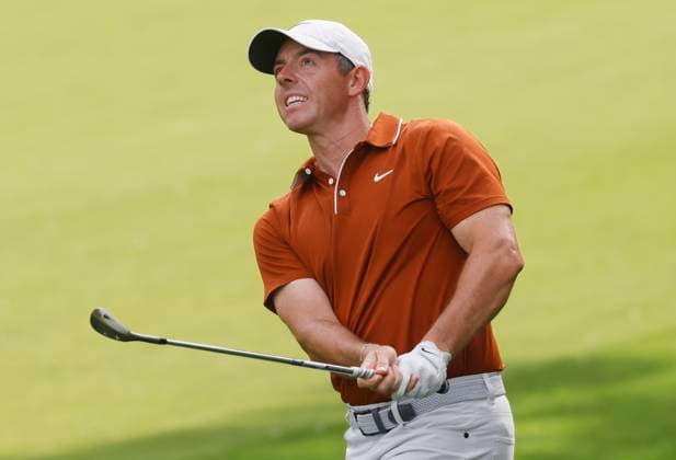 Rory McIlroy of Northern Ireland watches his shot after hitting out of the rough on the 12th hole during the second round of the 2025 PGA, Golf Herren Championship at the Quail Hollow Golf Club in Charlotte, North Carolina on Friday, May 16, 2025.  CHA20250516691 TANNENxMAURY