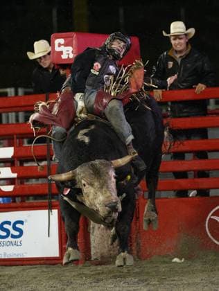 (250517) -- SURREY, May 17, 2025 -- A rider competes in the bull riding competition at the Cloverdale Rodeo and Country Fair in Surrey, British Columbia, Canada, May 16, 2025. As one of the largest rodeos in Canada, the annual Cloverdale Rodeo and Country Fair kicked off here on Friday. (Photo by Xinhua) (SP)CANADA-SURREY-CLOVERDALE RODEO LiangxSen 